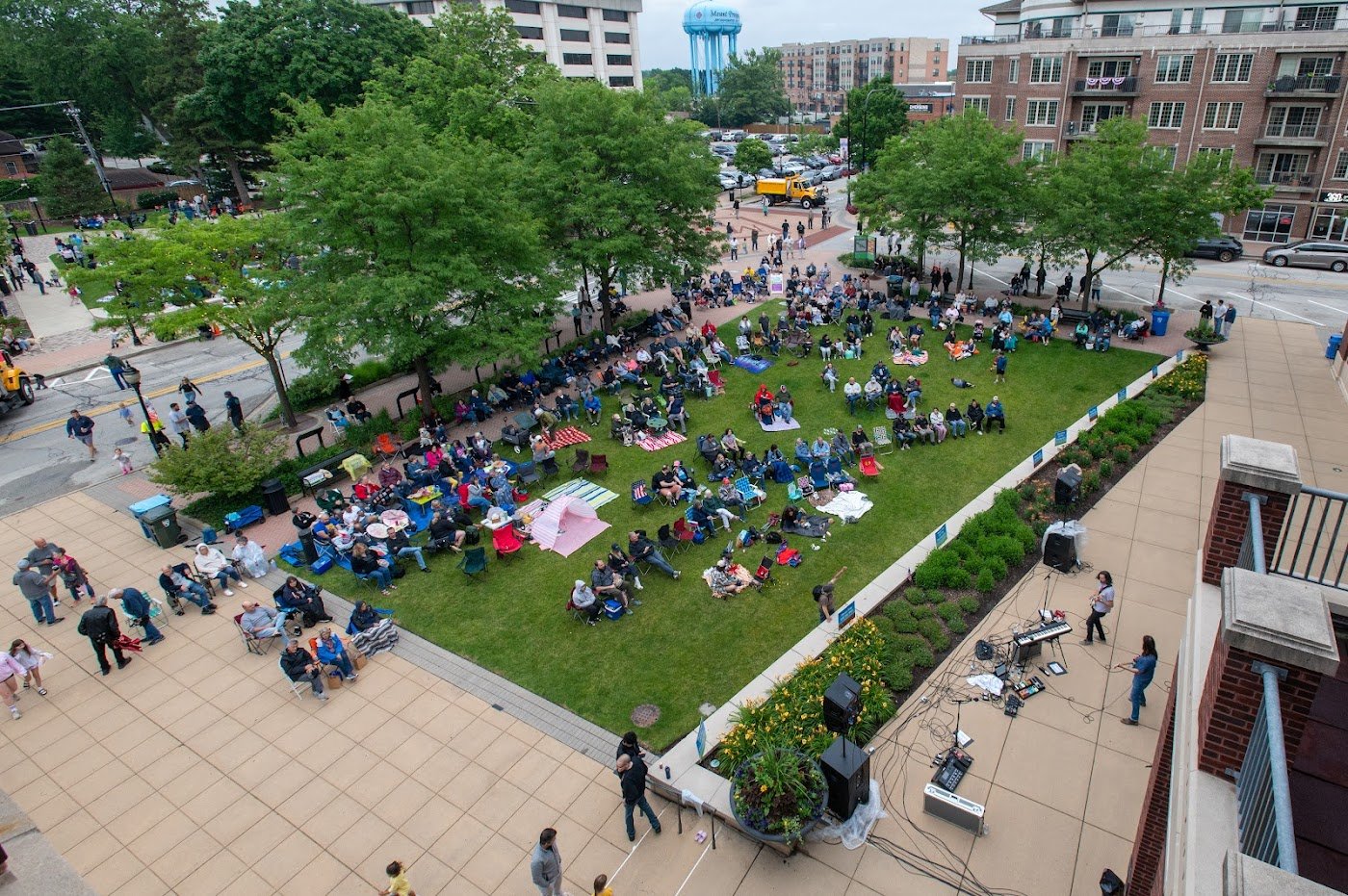 Wide view of the Fridays on the Green crowd at Centennial Green in Mount Prospect
