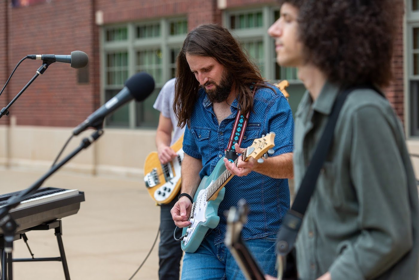 Turning Down Today guitarists performing live at Fridays on the Green