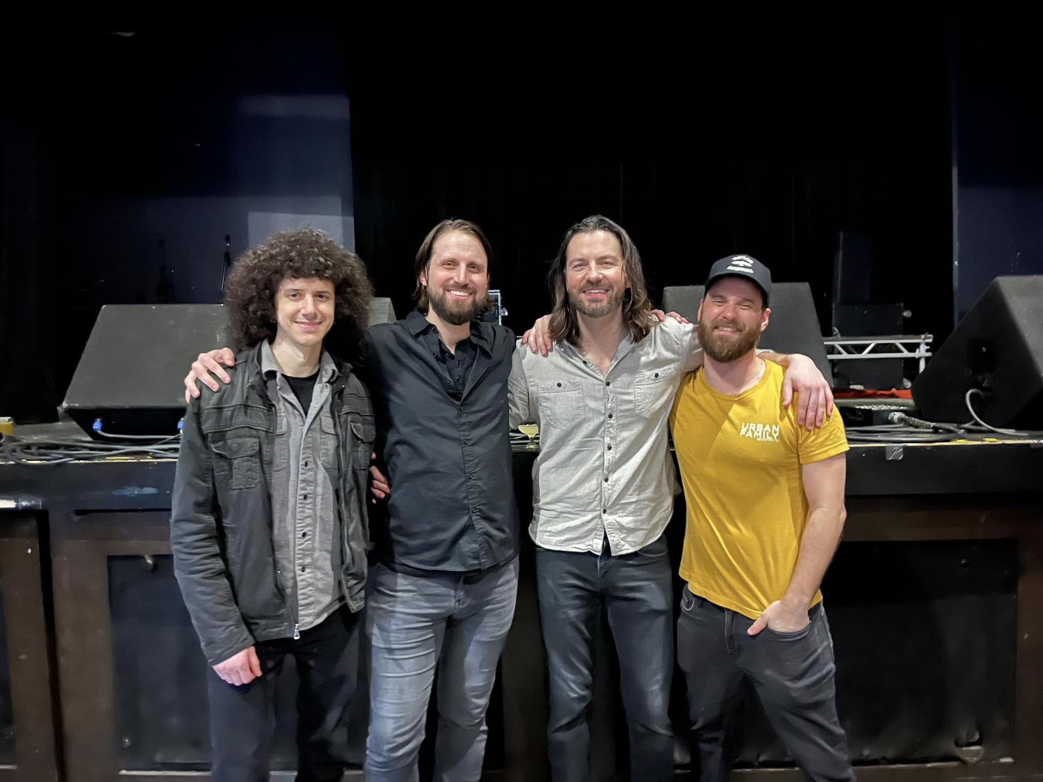 Turning Down Today band photo in front of stage